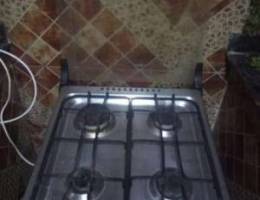 Gas cooker with cylinder