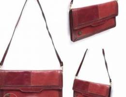 Two red colored leather bag
