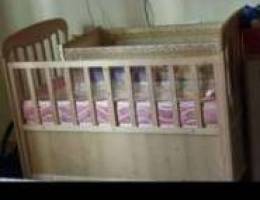 Baby crib with swing