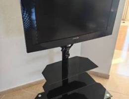 Samsung TV with stand and shelf تلفزيون مع ستاند