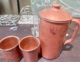 Pure copper jug and two glasses